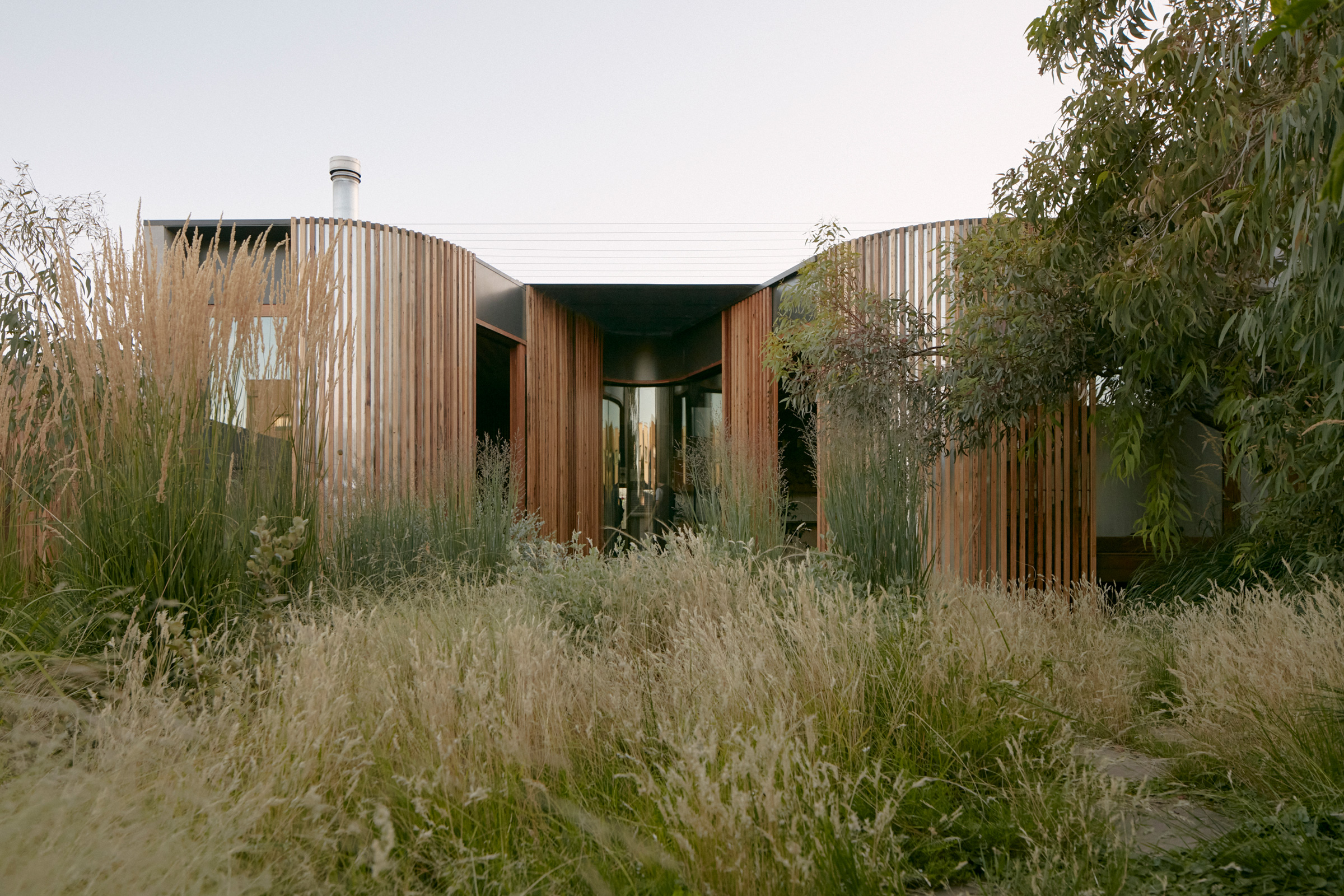 Vivarium timber exterior surrounded by planting